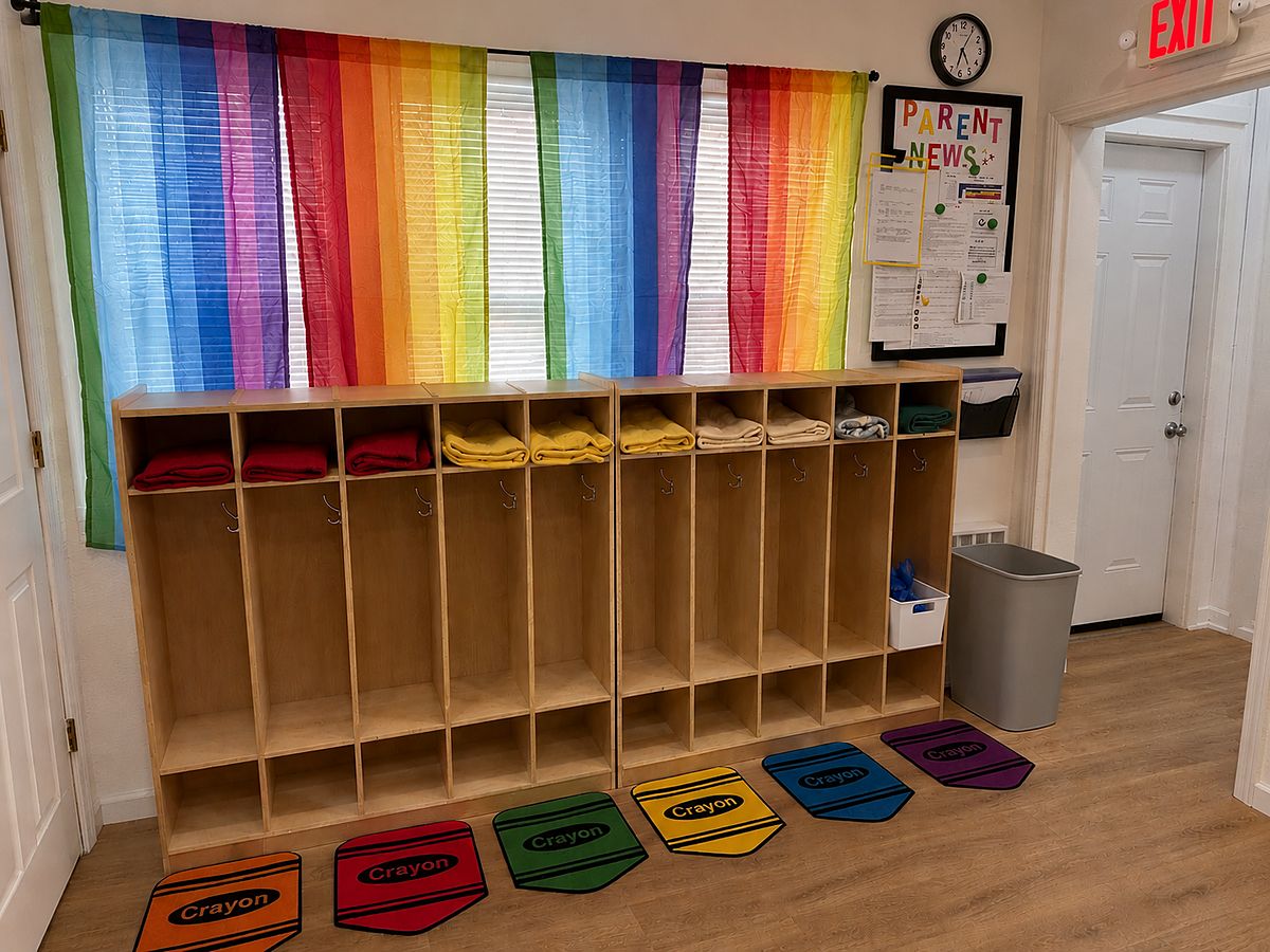 Cubbies and the rainbow window in the ECU arrival area
