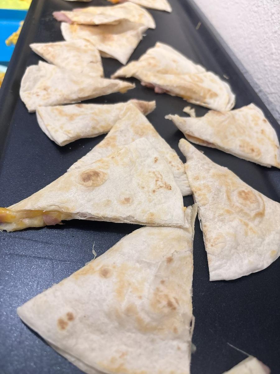 Ham and cheese quesadillas cut into triangles